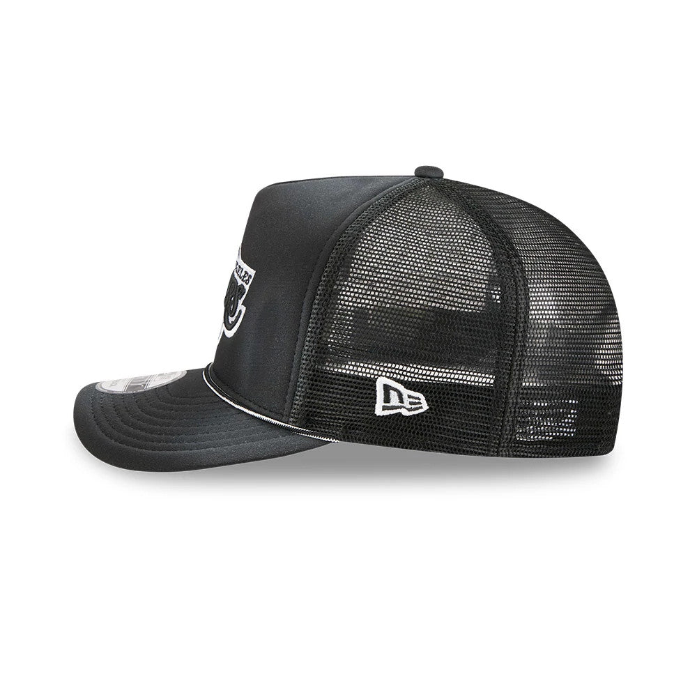 LA Lakers NBA Washed Black New Era 9FIFTY A-Frame Trucker Adjustable Cap, side view showing the white embroidered New Era flag logo on the black mesh panels and the curved visor with a 9FIFTY size sticker.