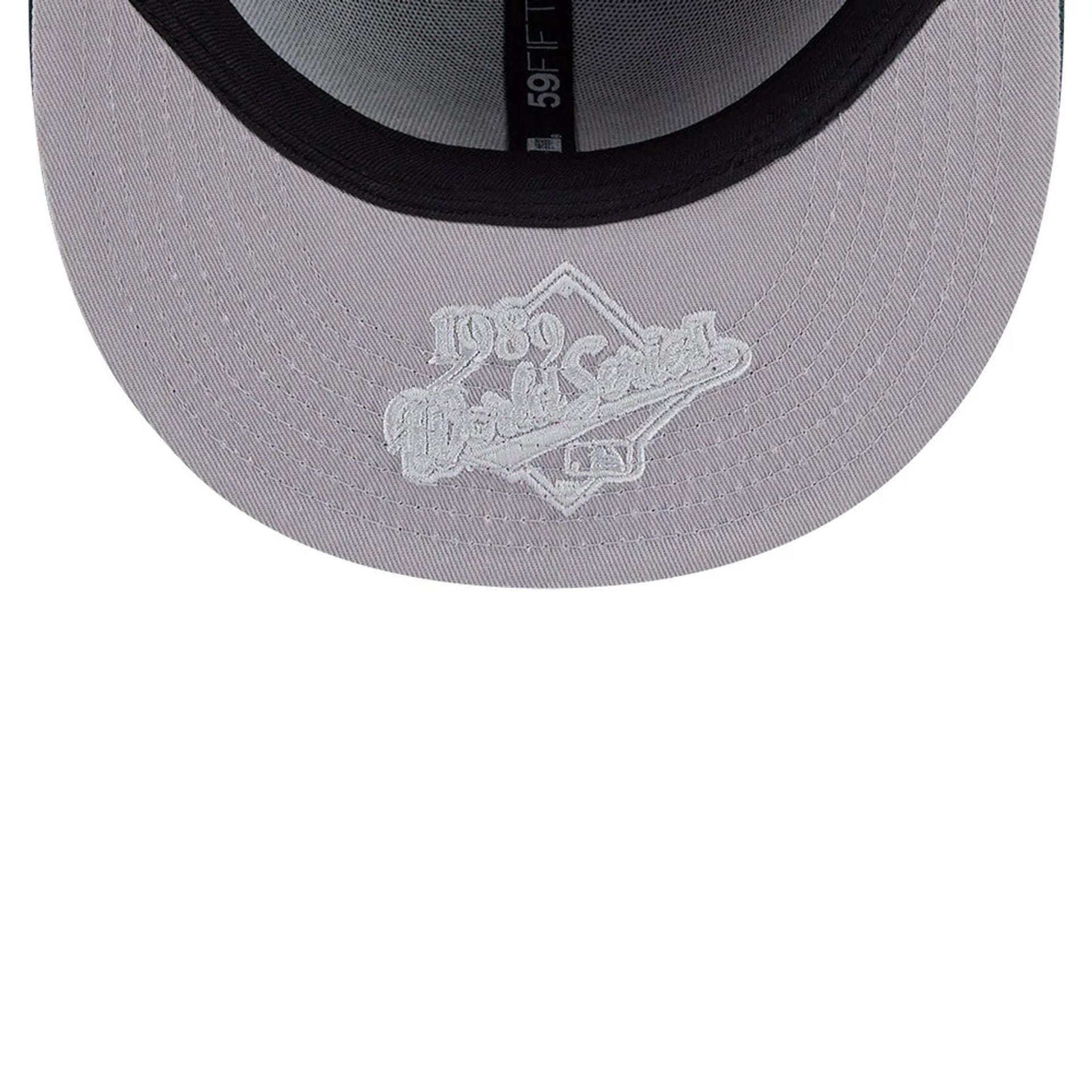 Pictured is this MLB Hidden Hit Athletics 59FIFTY Fitted cap in dark green. 2