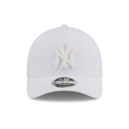 Pictured is this MLB Badged New York Yankees 9FORTY M-Crown A-Frame Trucker cap in white. 3