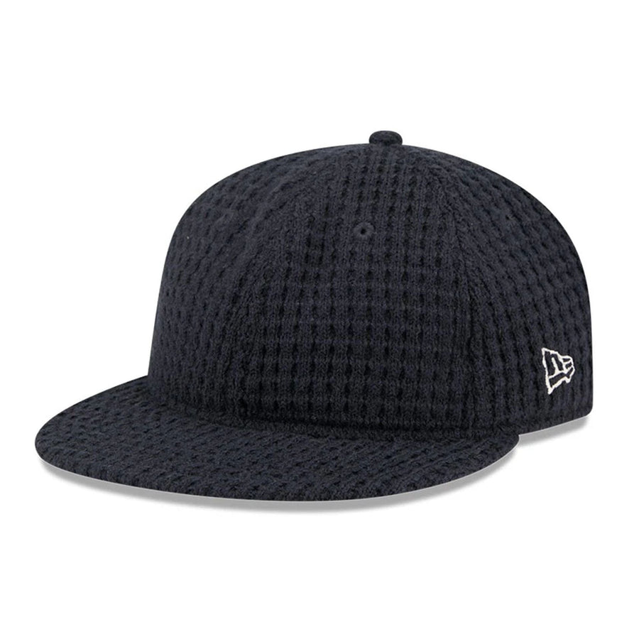 This is a  New Era Waffle Knit Navy Retro Crown 9FIFTY Adjustable Cap 1