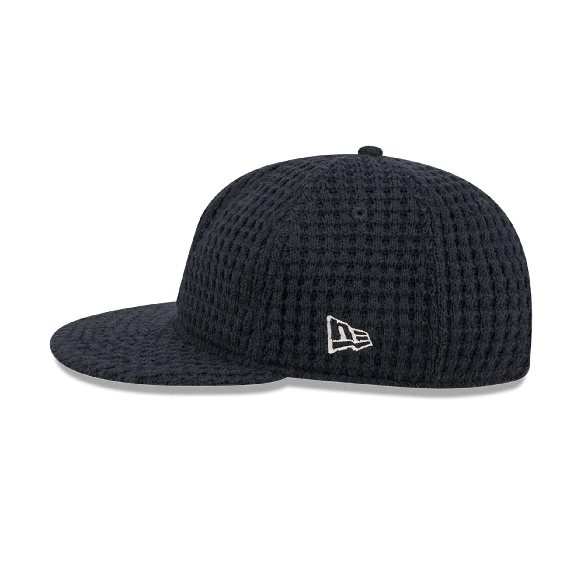 This is a  New Era Waffle Knit Navy Retro Crown 9FIFTY Adjustable Cap 6
