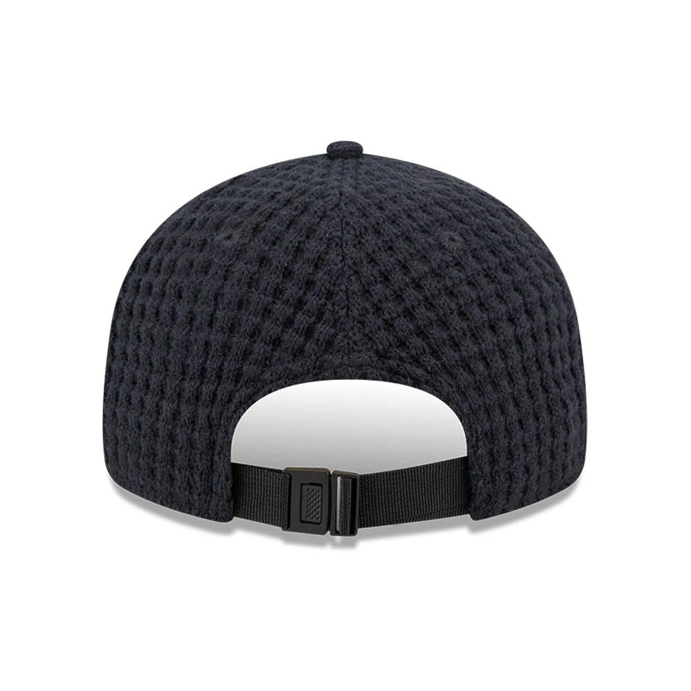 New Era Waffle Knit Navy Retro Crown 9FIFTY Adjustable Cap, rear view showing the textured waffle knit pattern on the navy crown and a black adjustable strap with a buckle closure at the back.