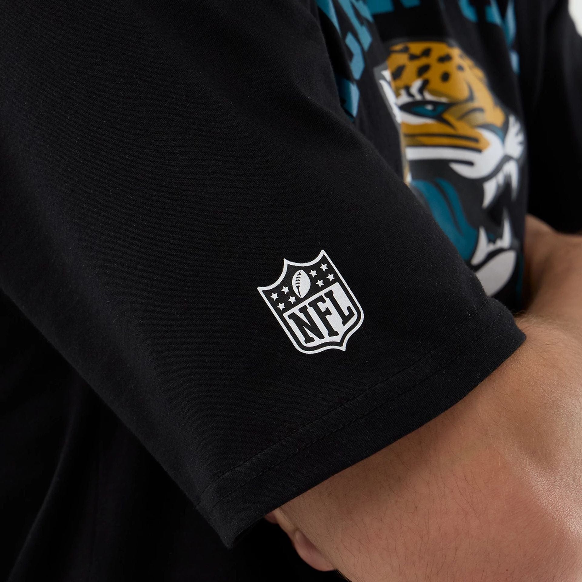 The Male model is wearing Jacksonville Jaguars NFL International Series Games Black Oversized T-Shirt  5