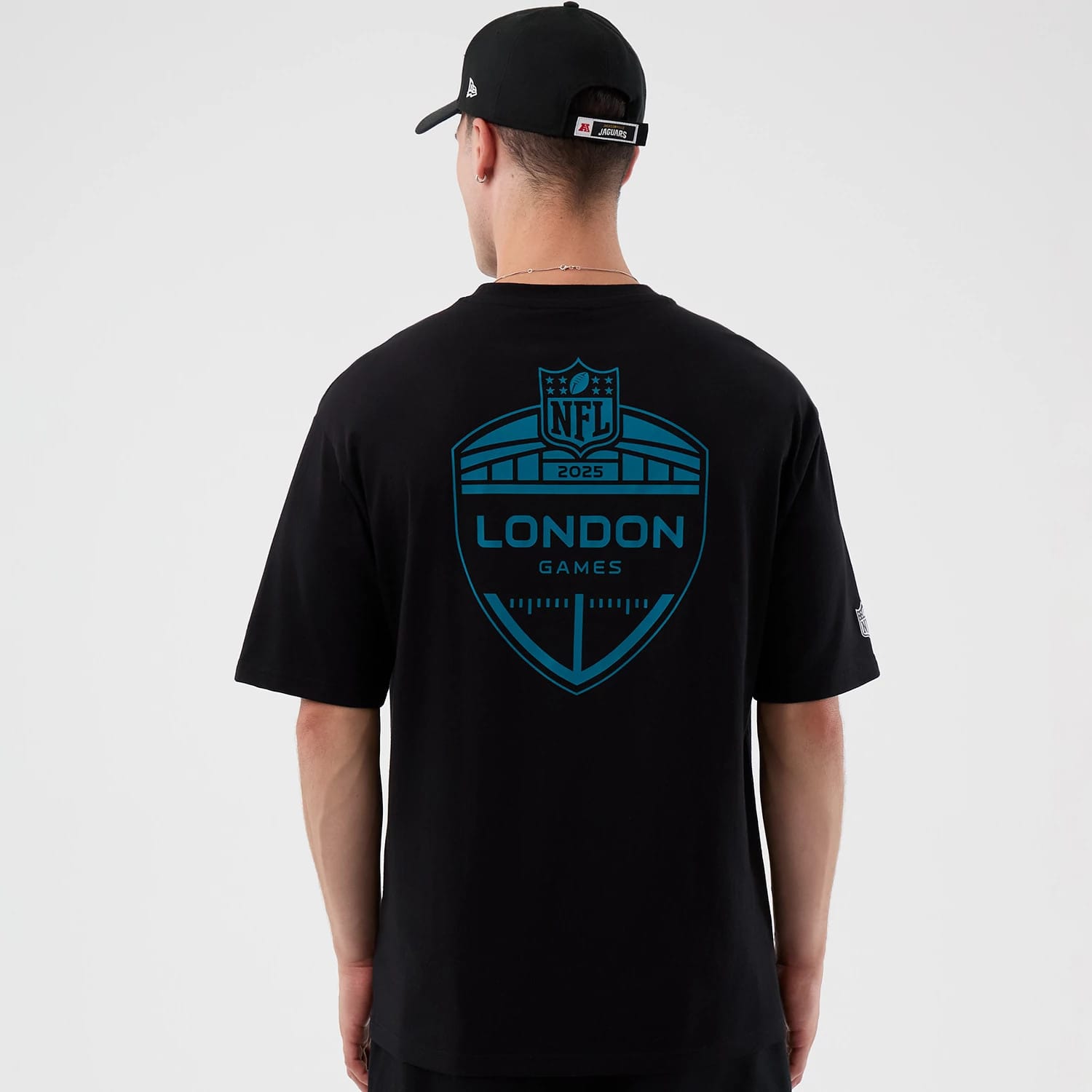 The Male model is wearing Jacksonville Jaguars NFL International Series Games Black Oversized T-Shirt 2