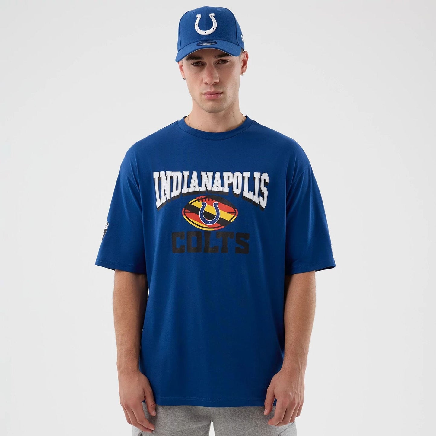 The Male model is wearing Indianapolis Colts NFL International Series Games Blue Oversized T-Shirt  1