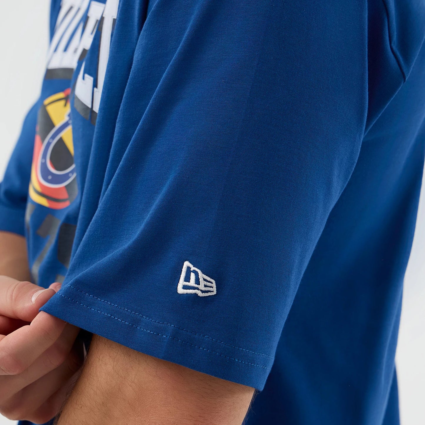 The Male model is wearing Indianapolis Colts NFL International Series Games Script Blue Oversized T-Shirt 4