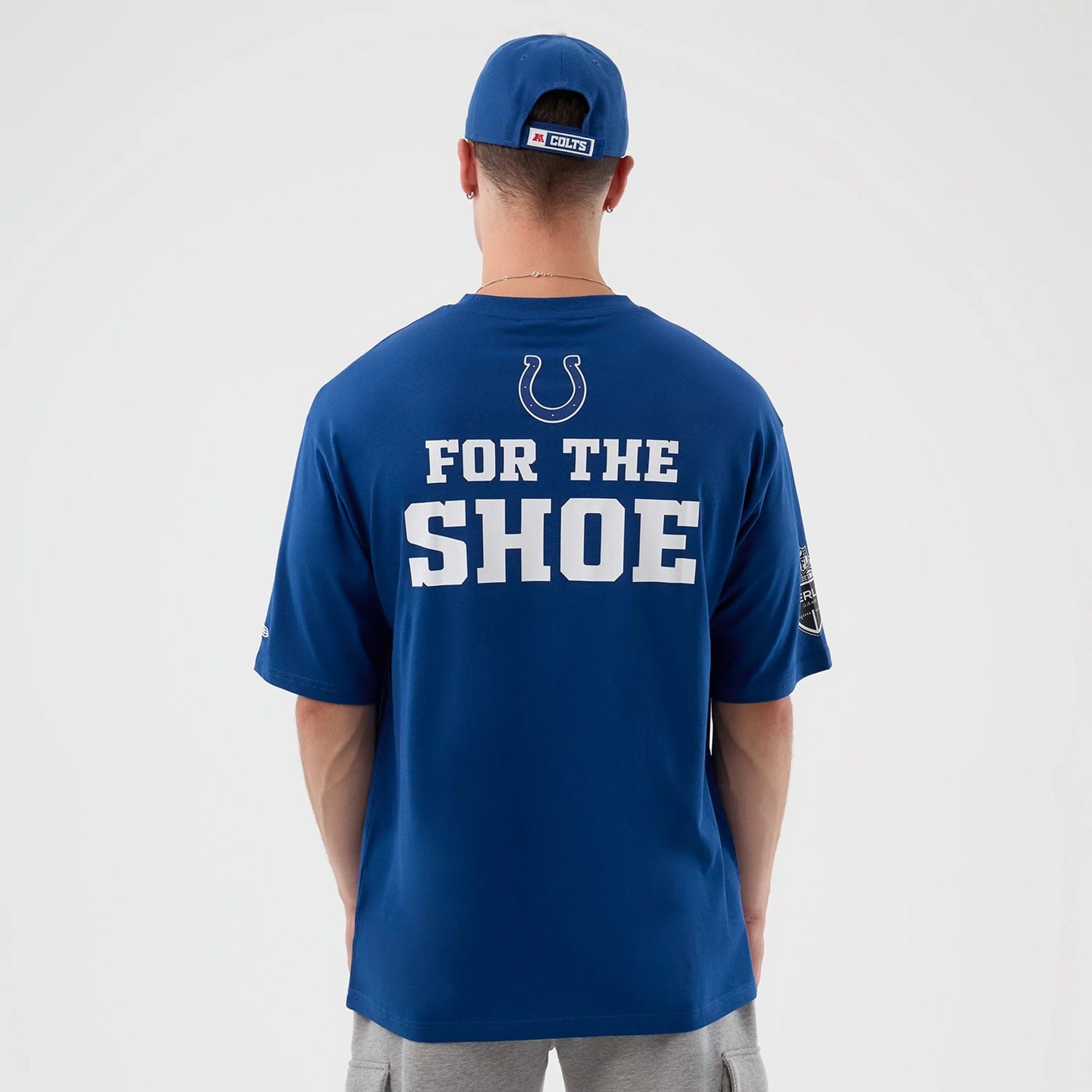 The Male model is wearing Indianapolis Colts NFL International Series Games Blue Oversized T-Shirt  2