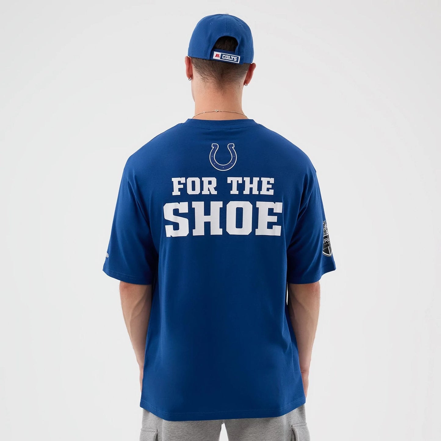 The Male model is wearing Indianapolis Colts NFL International Series Games Blue Oversized T-Shirt 2