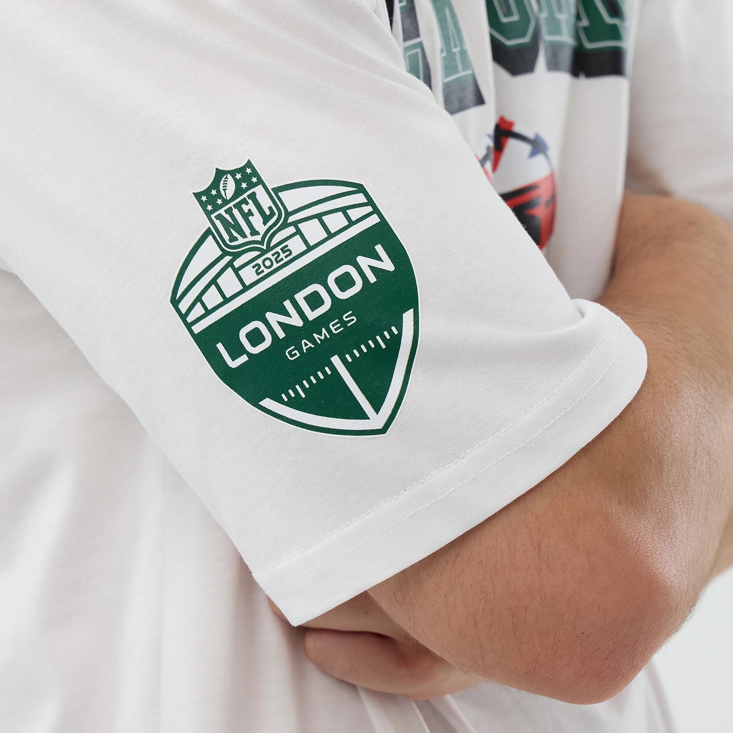 The Male model is wearing New York Jets NFL International Series Games White Oversized T-Shirt 4