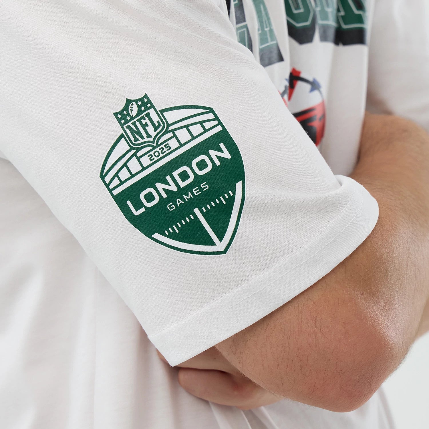 The Male model is wearing New York Jets NFL International Series Games White Oversized T-Shirt 4