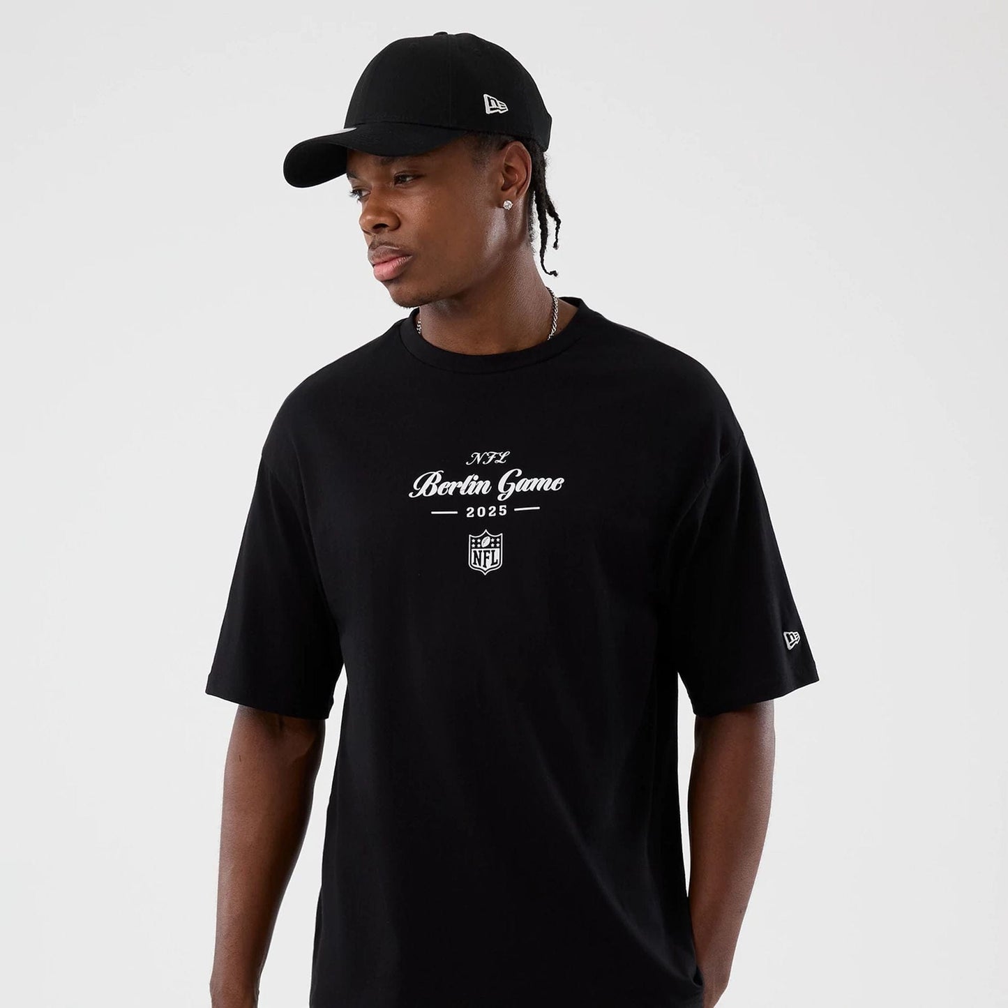 The Male model is wearing Berlin NFL International Series Games Black Oversized T-Shirt  5