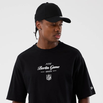 The Male model is wearing Berlin NFL International Series Games Black Oversized T-Shirt 6