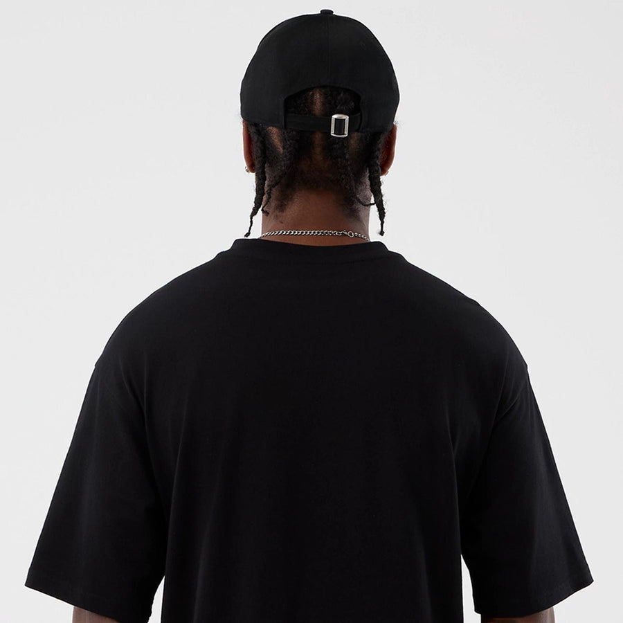 The Male model is wearing Berlin NFL International Series Games Black Oversized T-Shirt  7