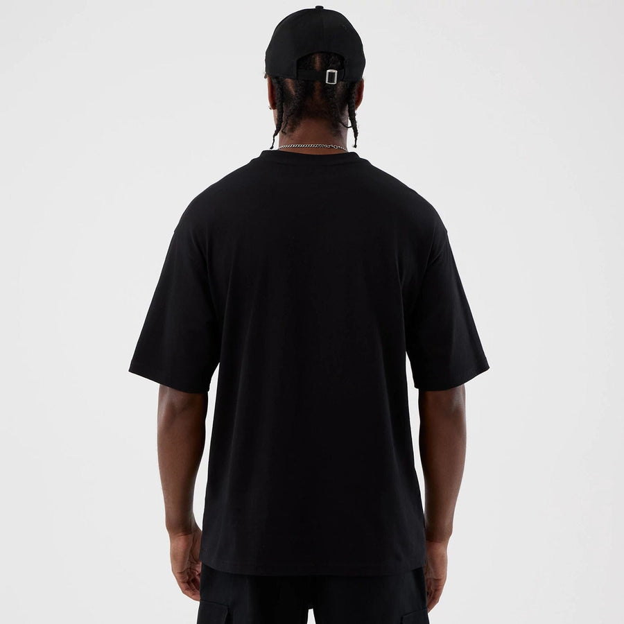 The Male model is wearing Berlin NFL International Series Games Black Oversized T-Shirt  2