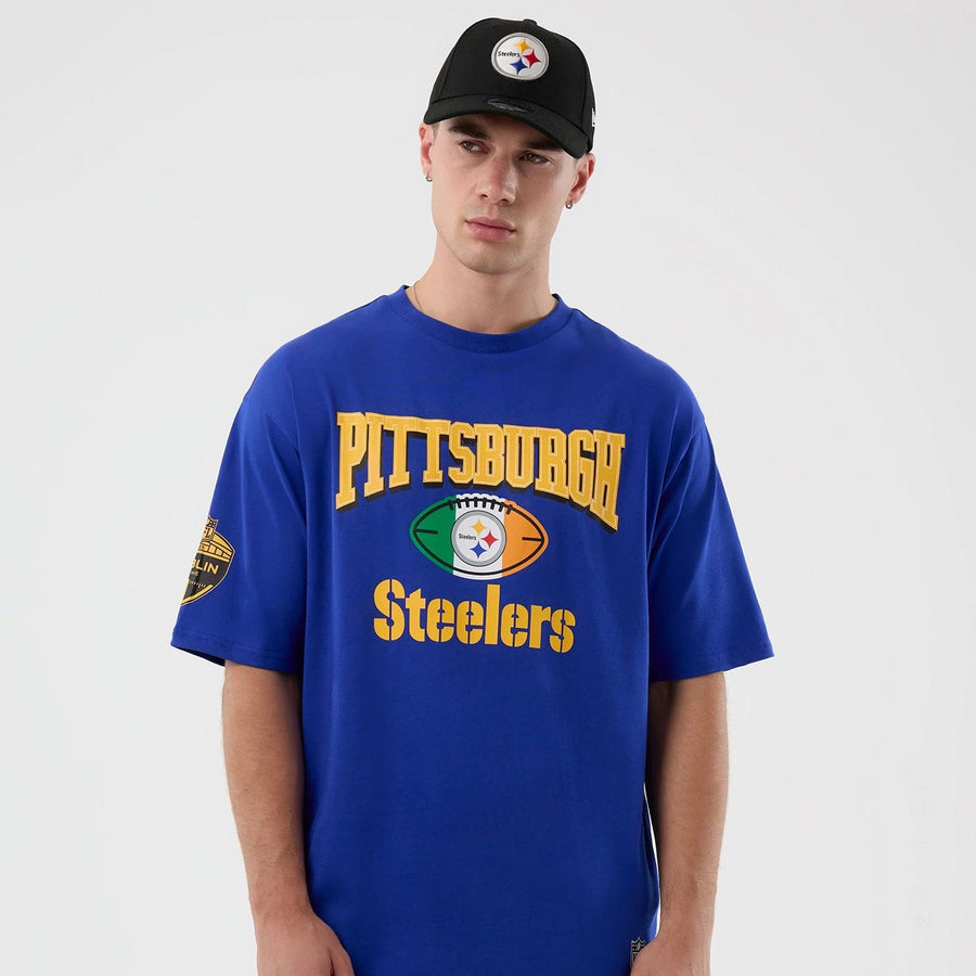 The Male model is wearing Pittsburgh Steelers NFL International Series Games Blue Oversized T-Shirt  7