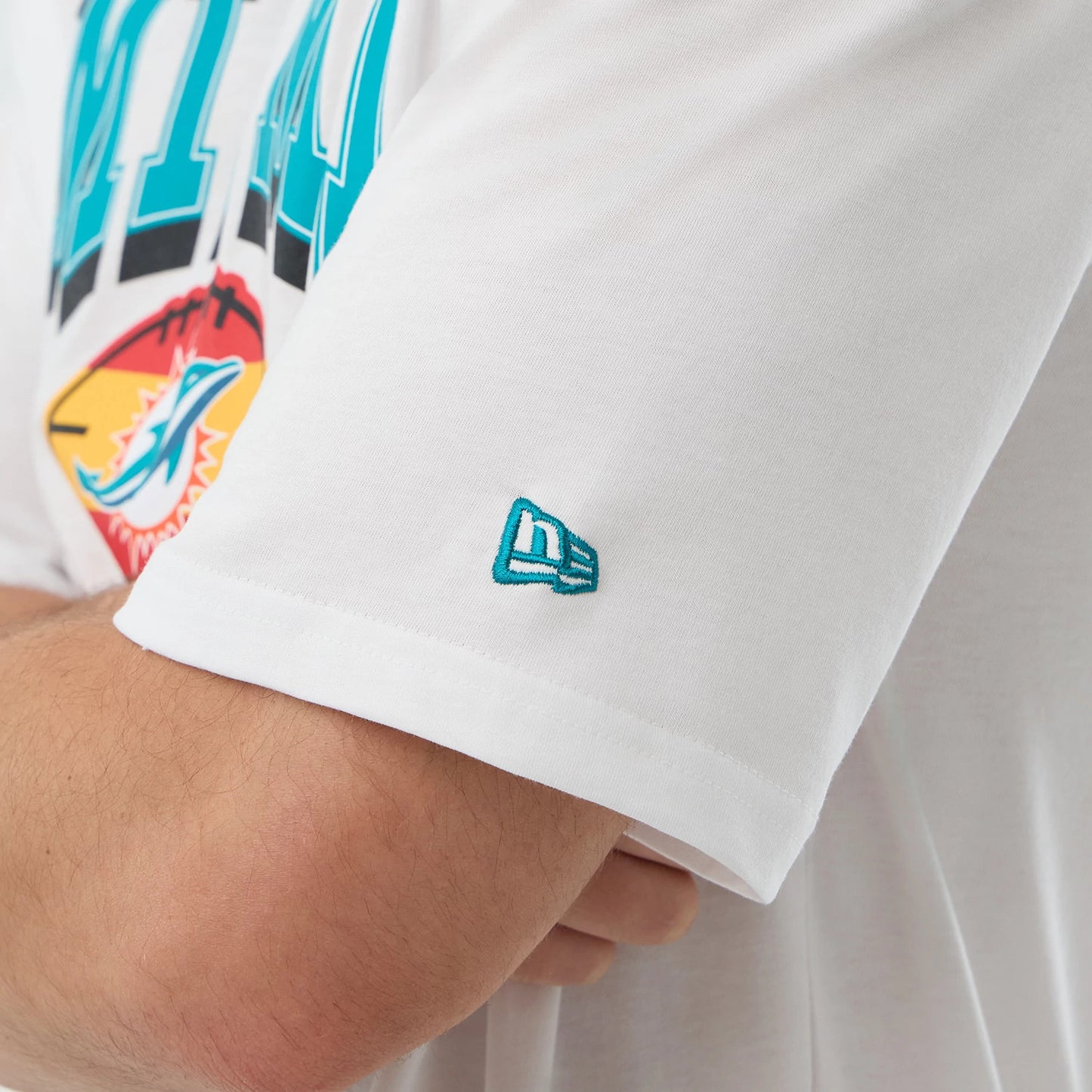 The Male model is wearing a Miami Dolphins NFL International Series Games Madrid White Oversized T-Shirt 5