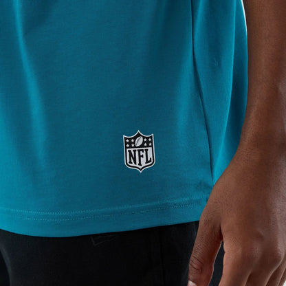 The Male model is wearing Jacksonville Jaguars NFL International Series Games Turquoise Oversized T-Shirt  5