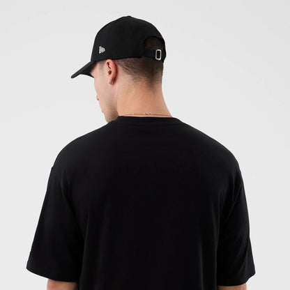 The Male model is wearing London Games NFL International Series Games Black Oversized T-Shirt  7