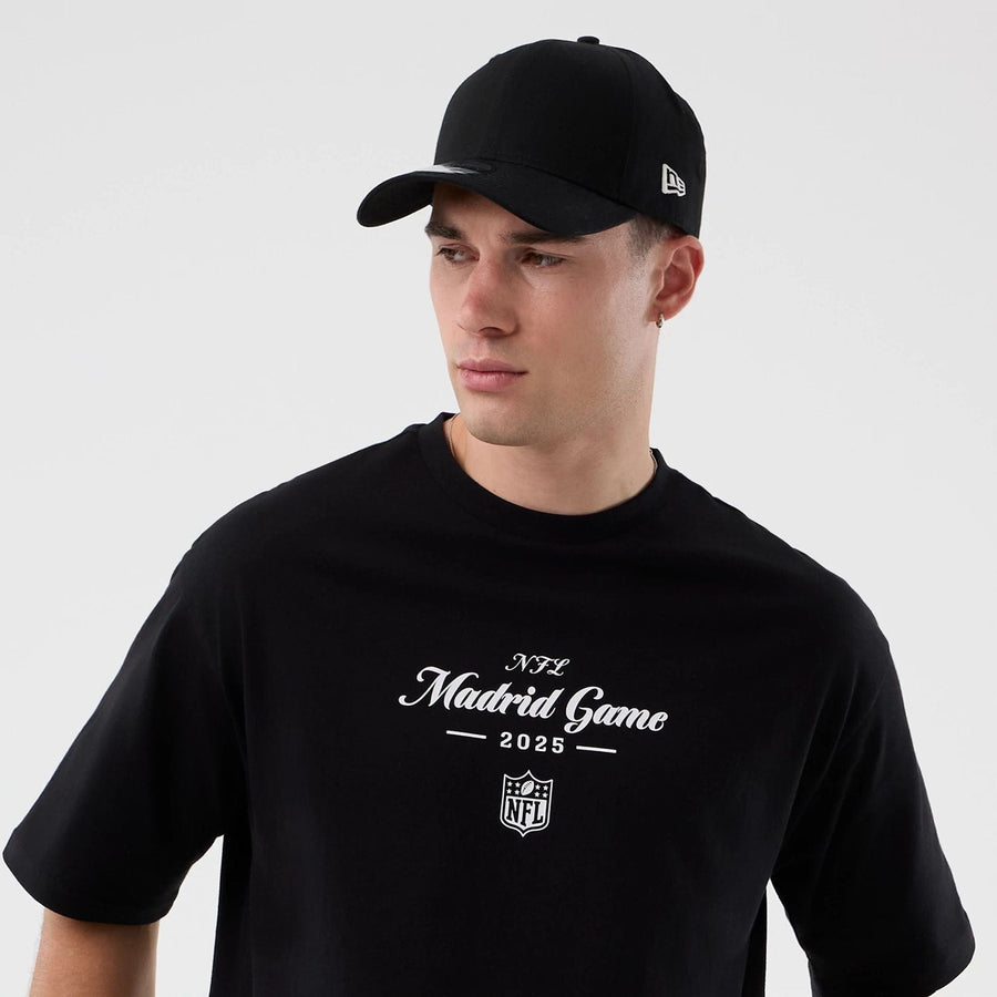 The Male model is wearing Madrid Game NFL International Series Games Black Oversized T-Shirt  6