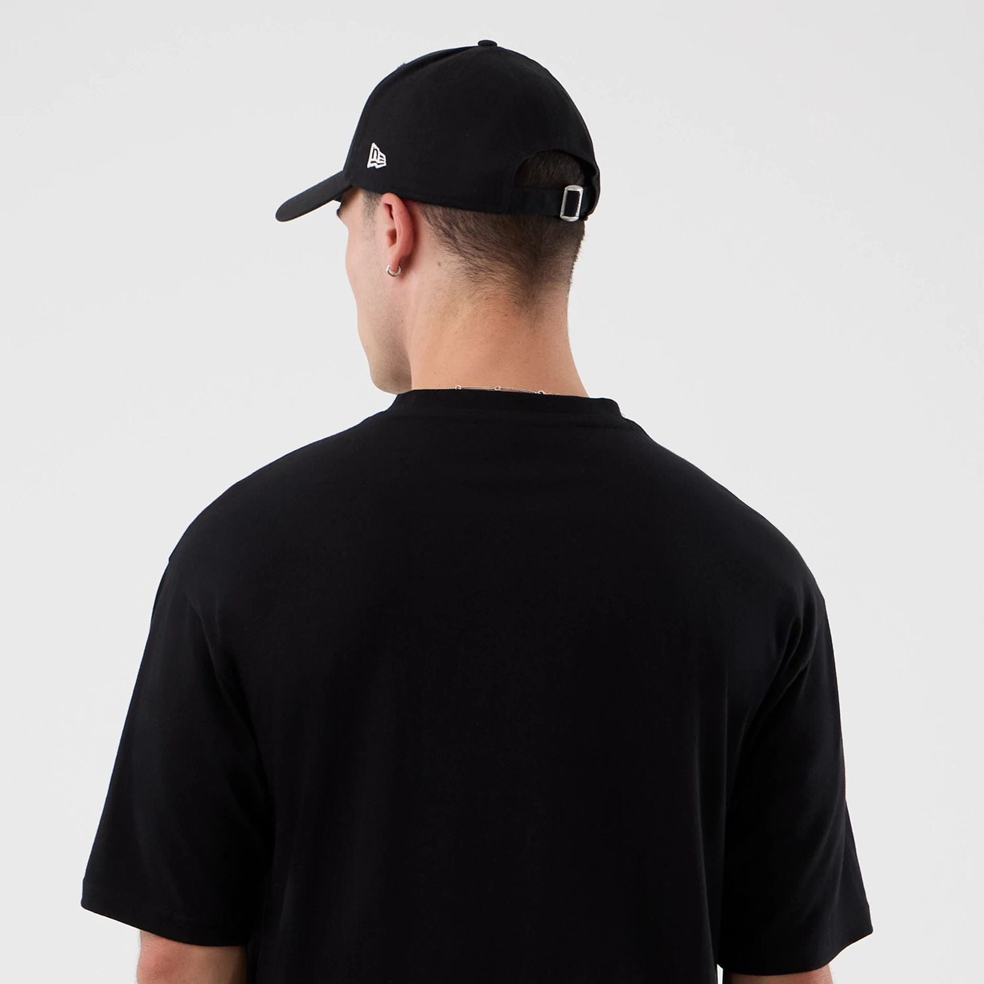 The Male model is wearing Dublin Game NFL International Series Games Black Oversized T-Shirt  7