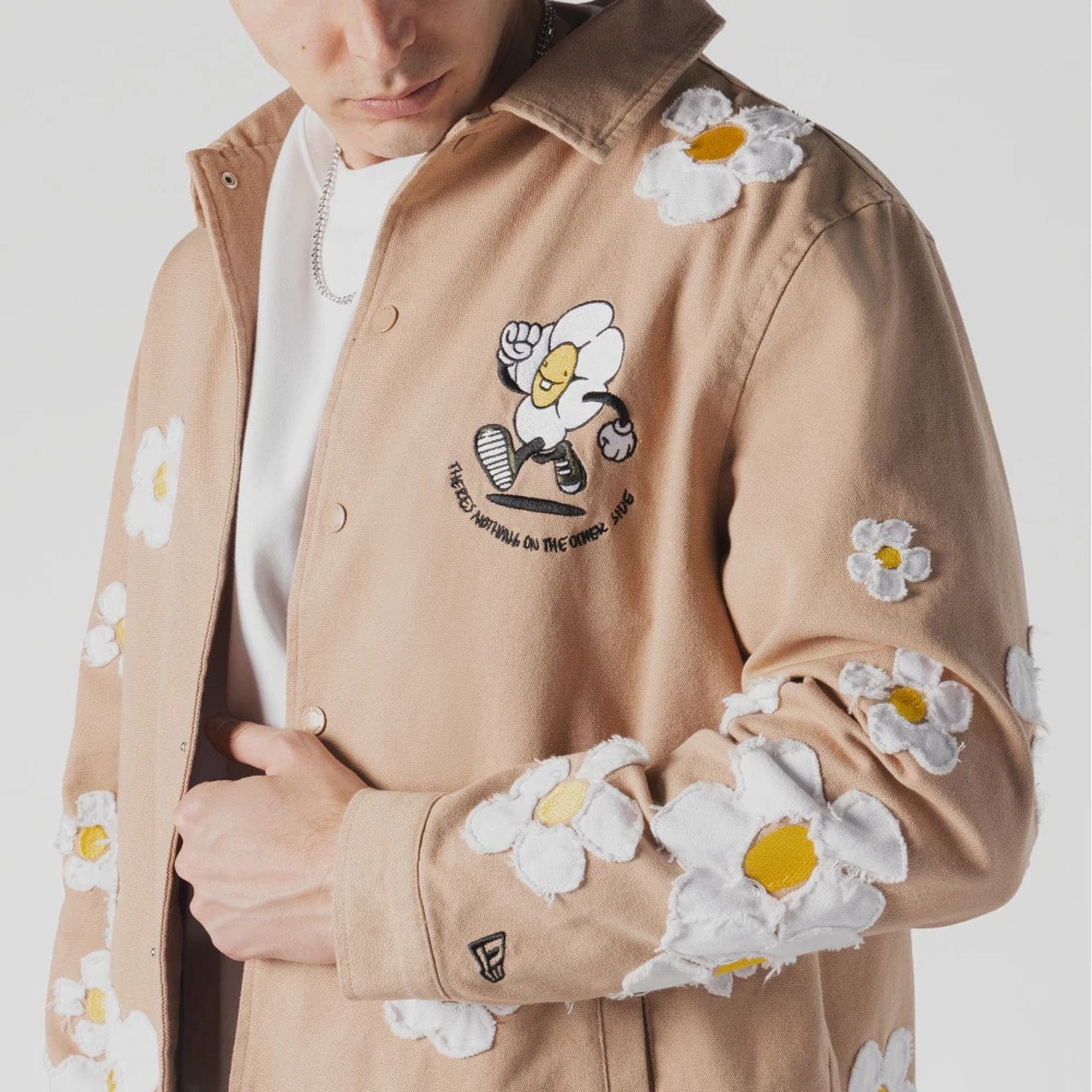 The Male model is wearing  New Era x Rodrigo Roji Flower Light Beige Jacket  3