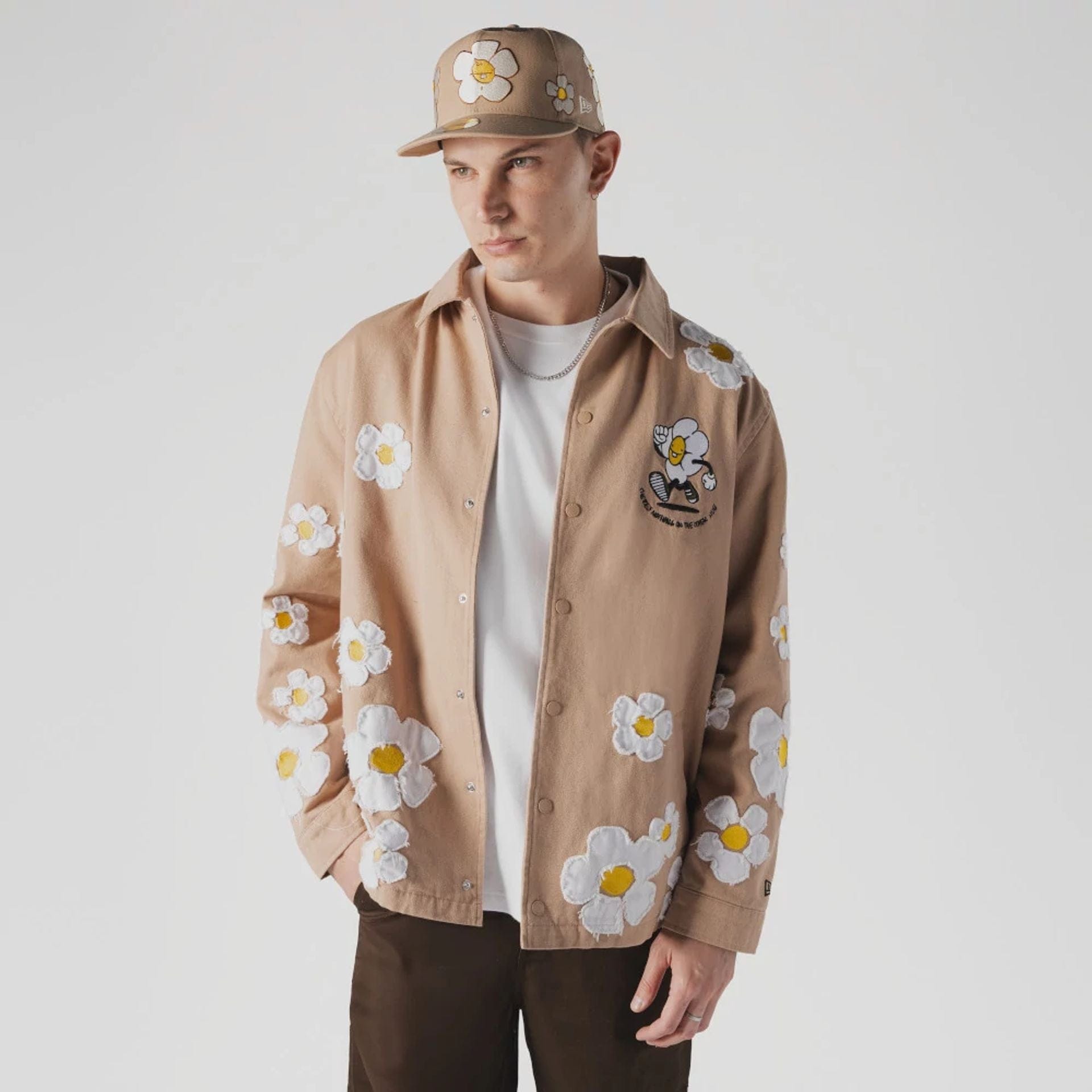The Male model is wearing  New Era x Rodrigo Roji Flower Light Beige Jacket  1