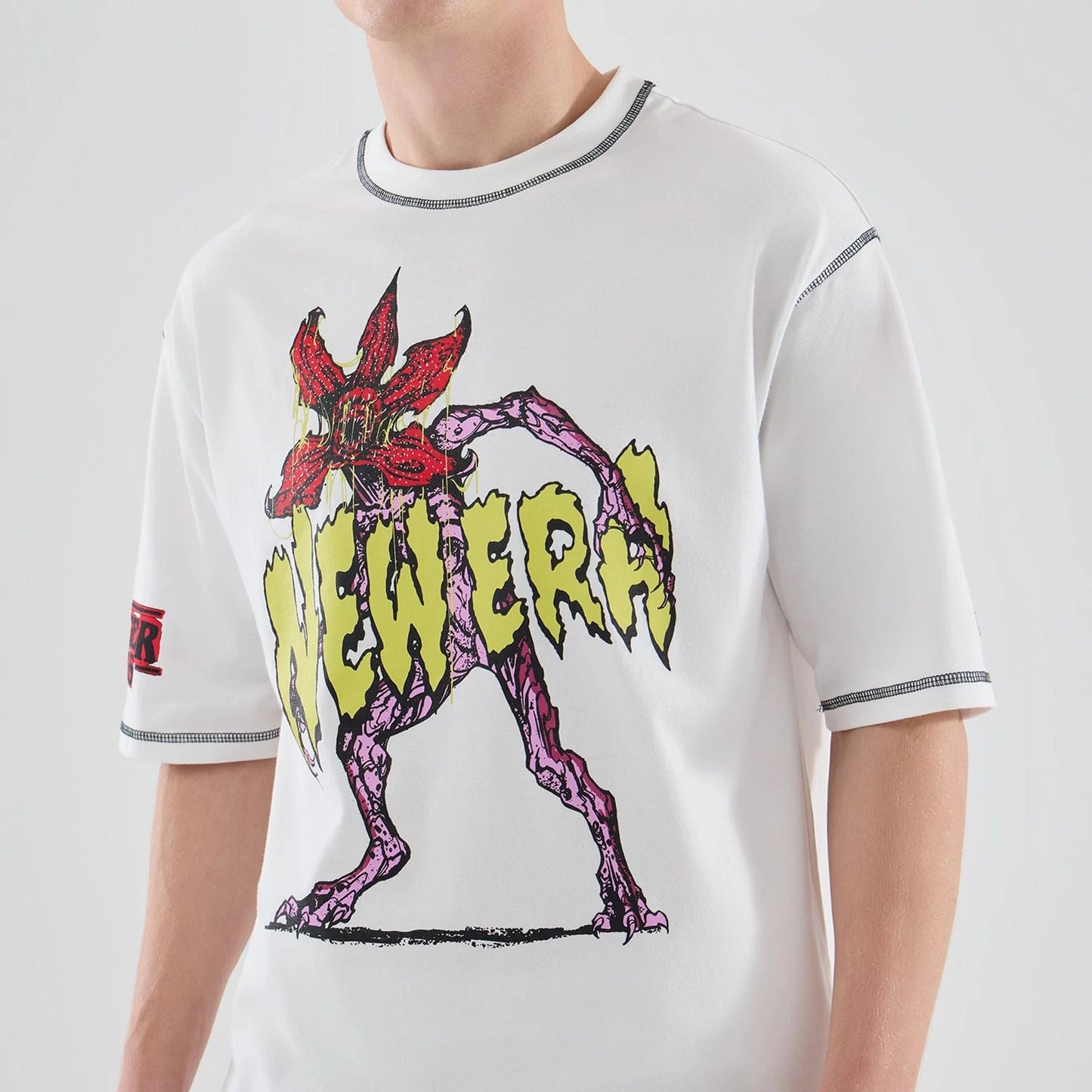 The Male model is wearing Stranger Things White Oversized T-Shirt  6