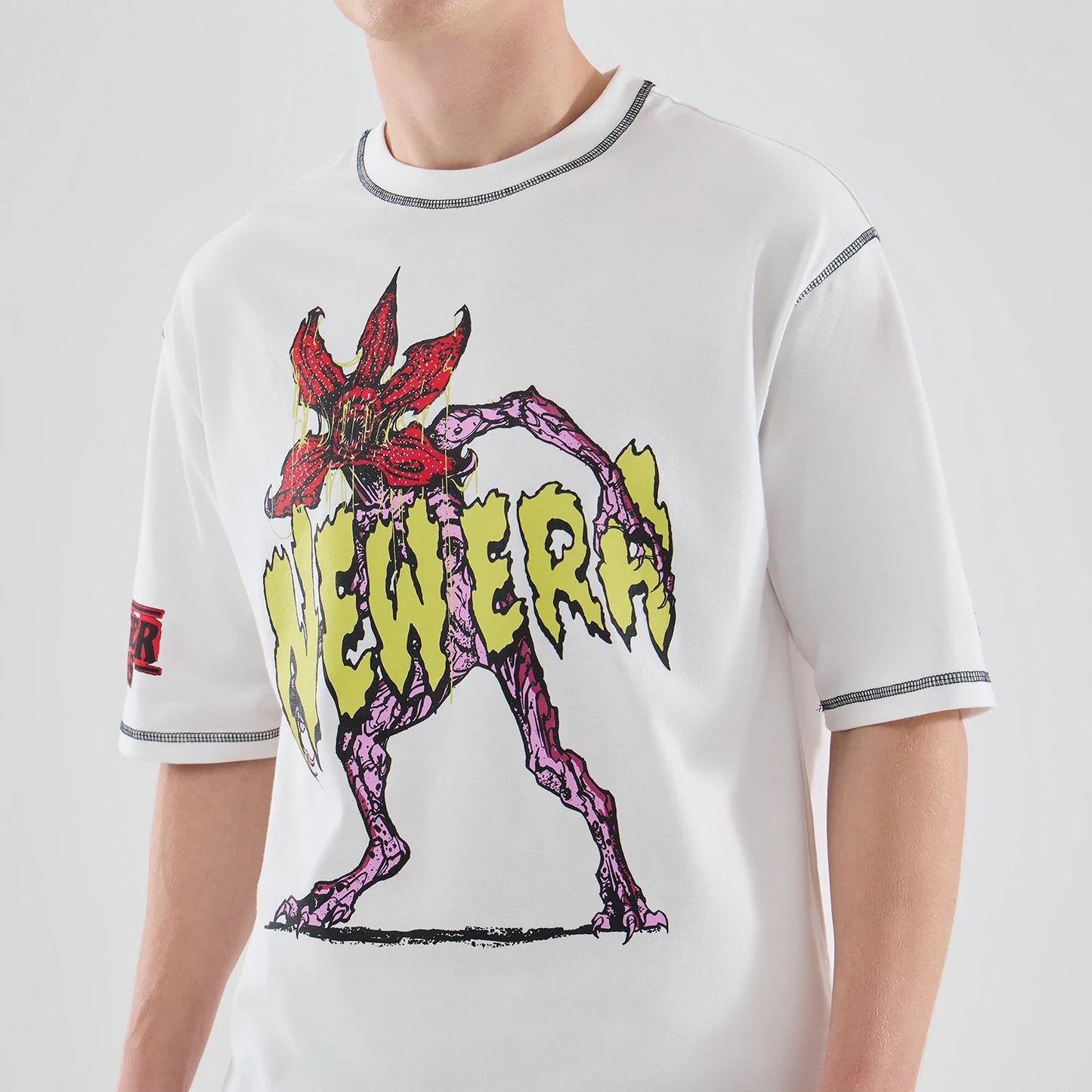 The Male model is wearing Stranger Things White Oversized T-Shirt 6