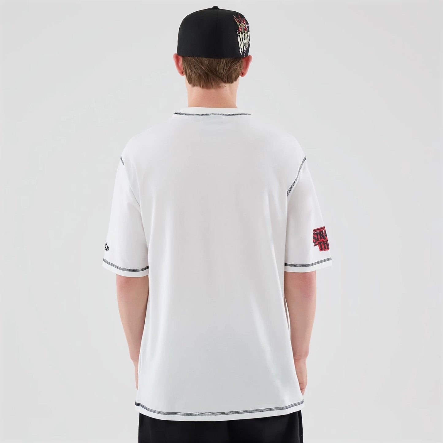 The Male model is wearing Stranger Things White Oversized T-Shirt  2