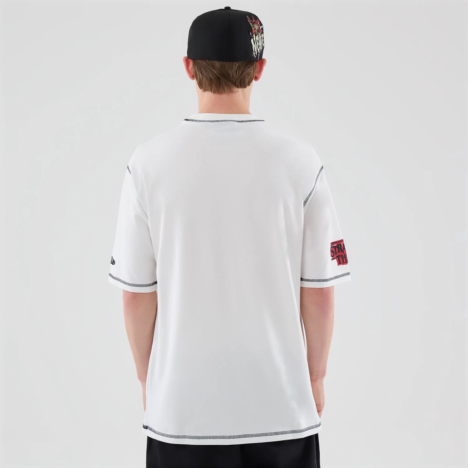 The Male model is wearing Stranger Things White Oversized T-Shirt  2