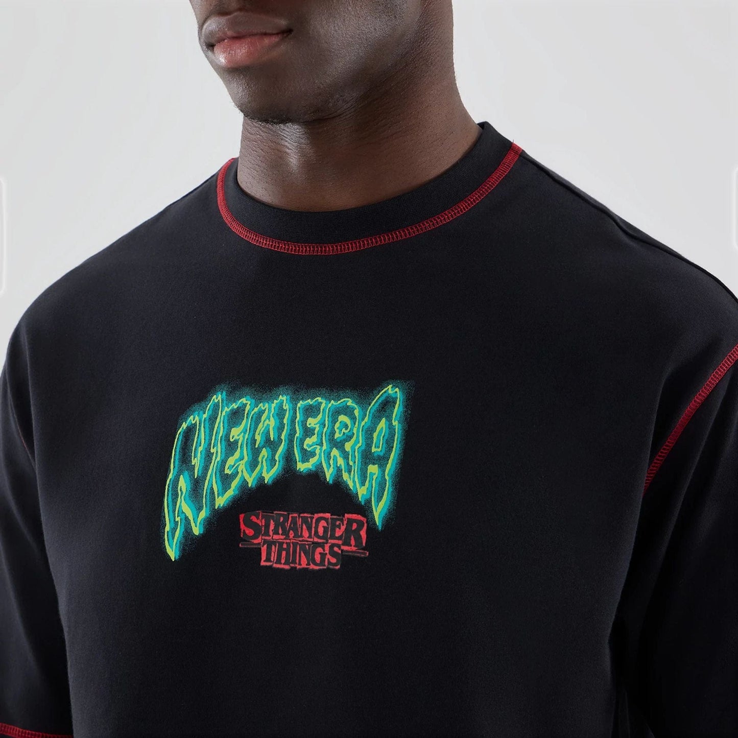 The Male model is wearing Stranger Things Black Oversized T-Shirt  6
