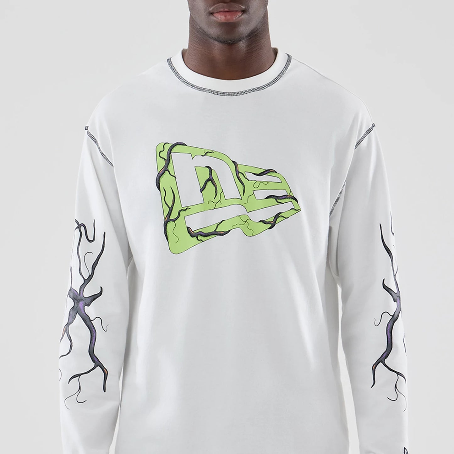 The Male model is wearing Stranger Things White Oversized Long Sleeve T-Shirt 3