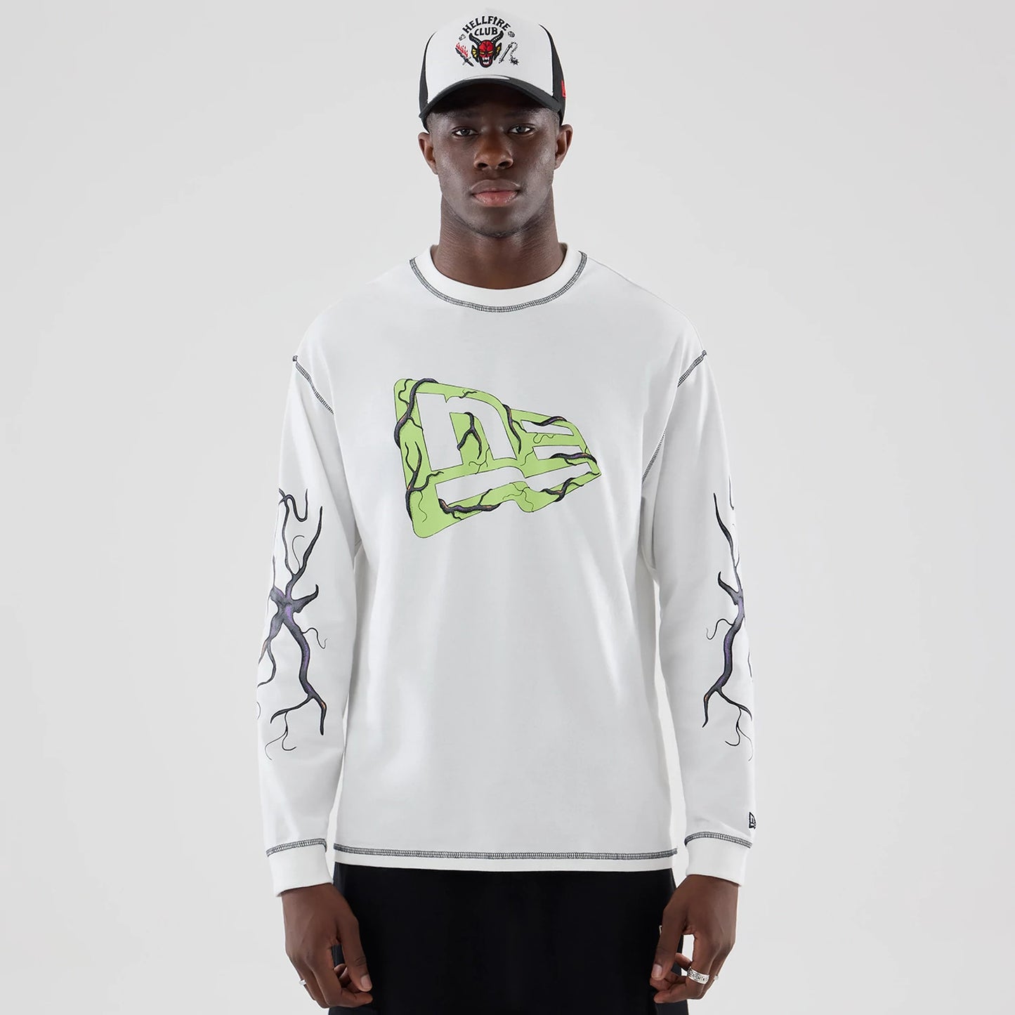 The Male model is wearing Stranger Things White Oversized Long Sleeve T-Shirt 1
