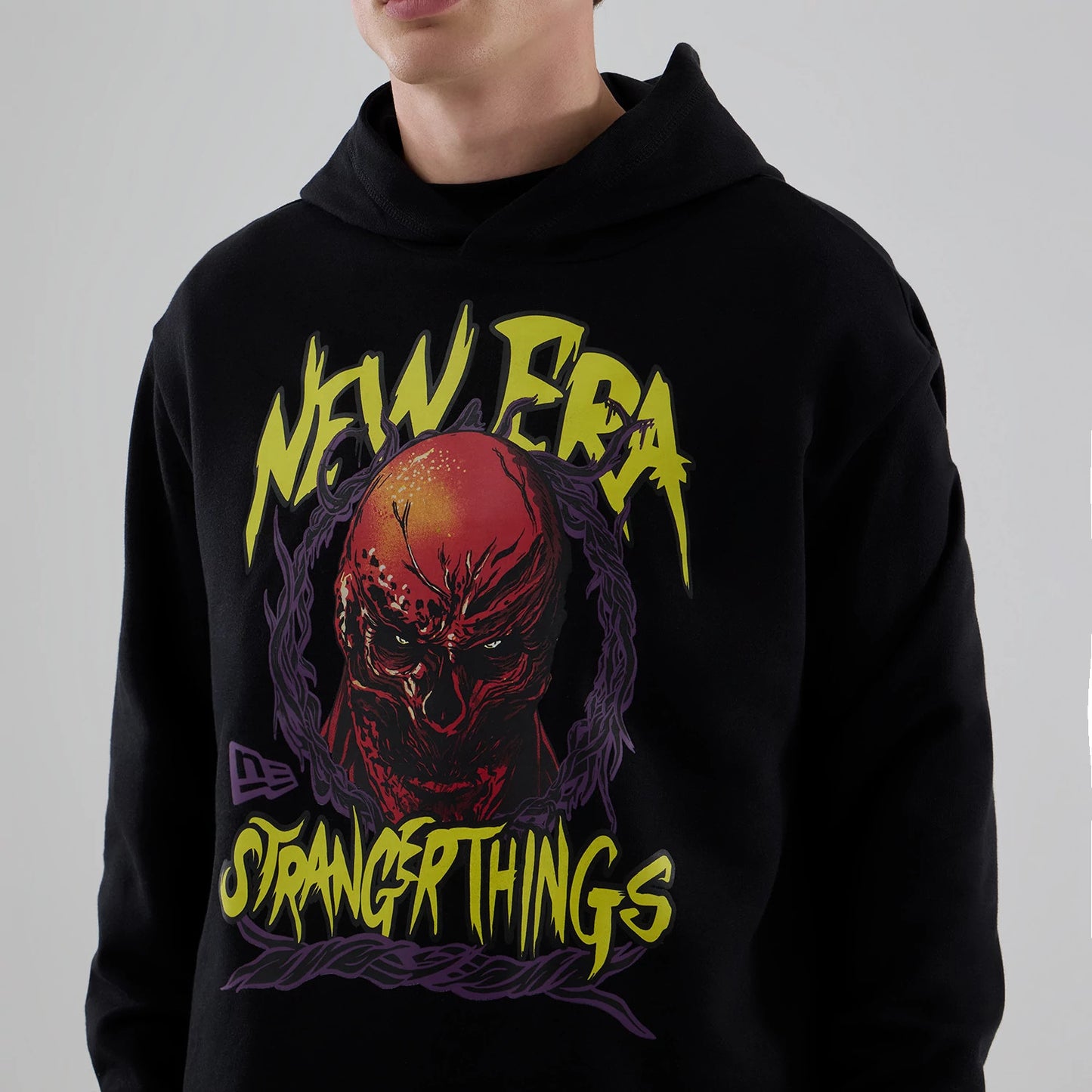 The Male model is wearing Stranger Things Black Oversized Pullover Hoodie 6
