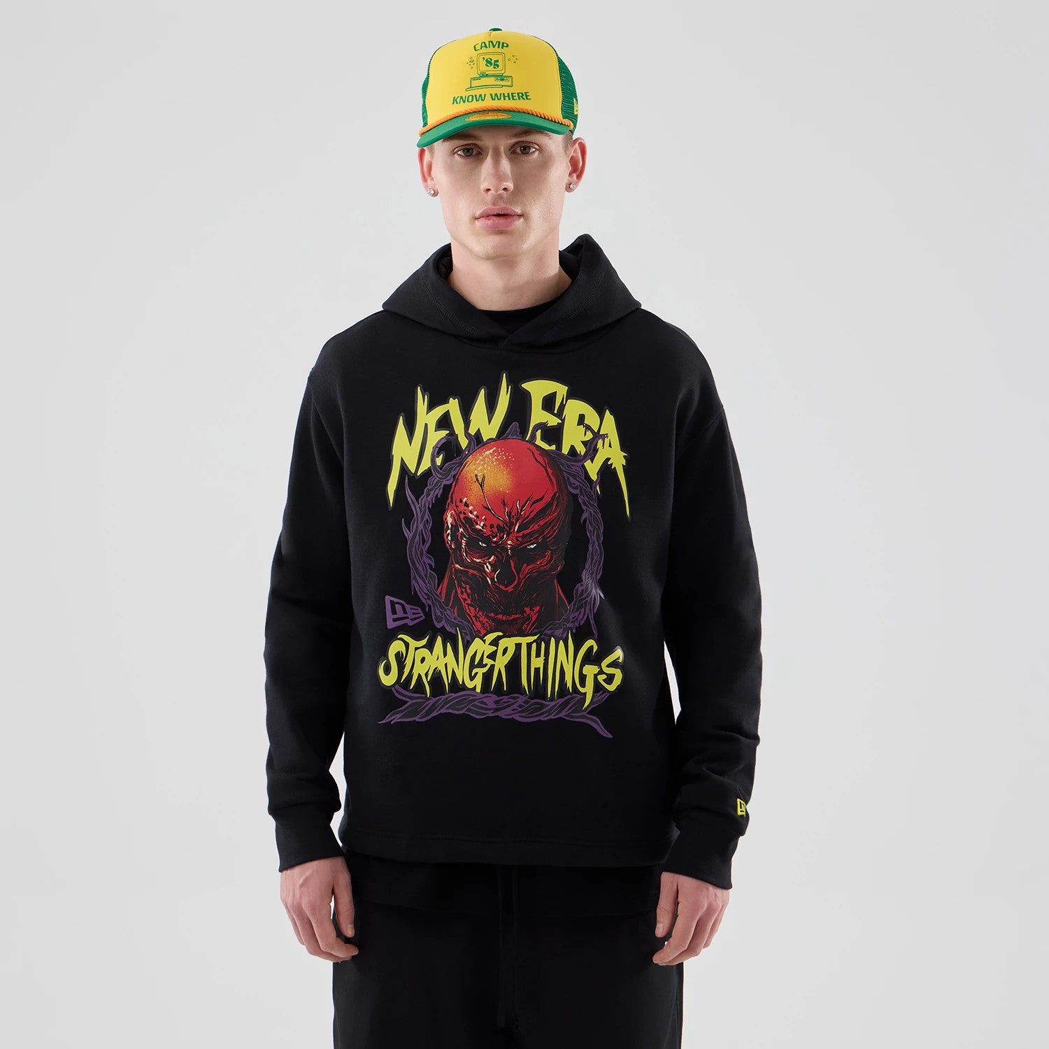 The Male model is wearing Stranger Things Black Oversized Pullover Hoodie 1