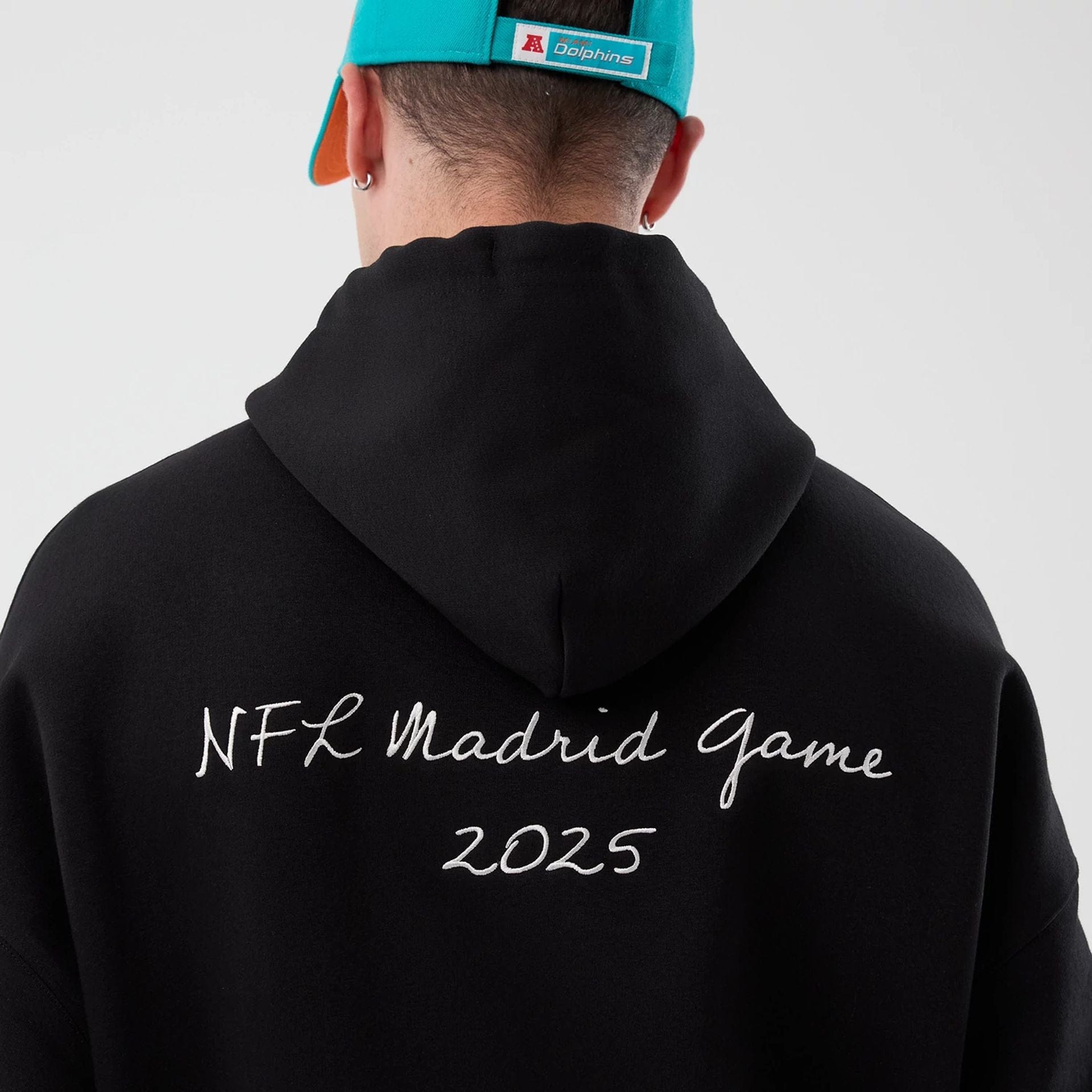 The Male model is wearing Miami Dolphins NFL International Series Games Black Pullover Hoodie  6