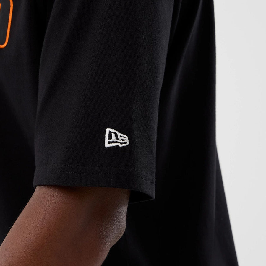 The Male model is wearing Cleveland Browns NFL International Series Games Black Oversized T-Shirt  5