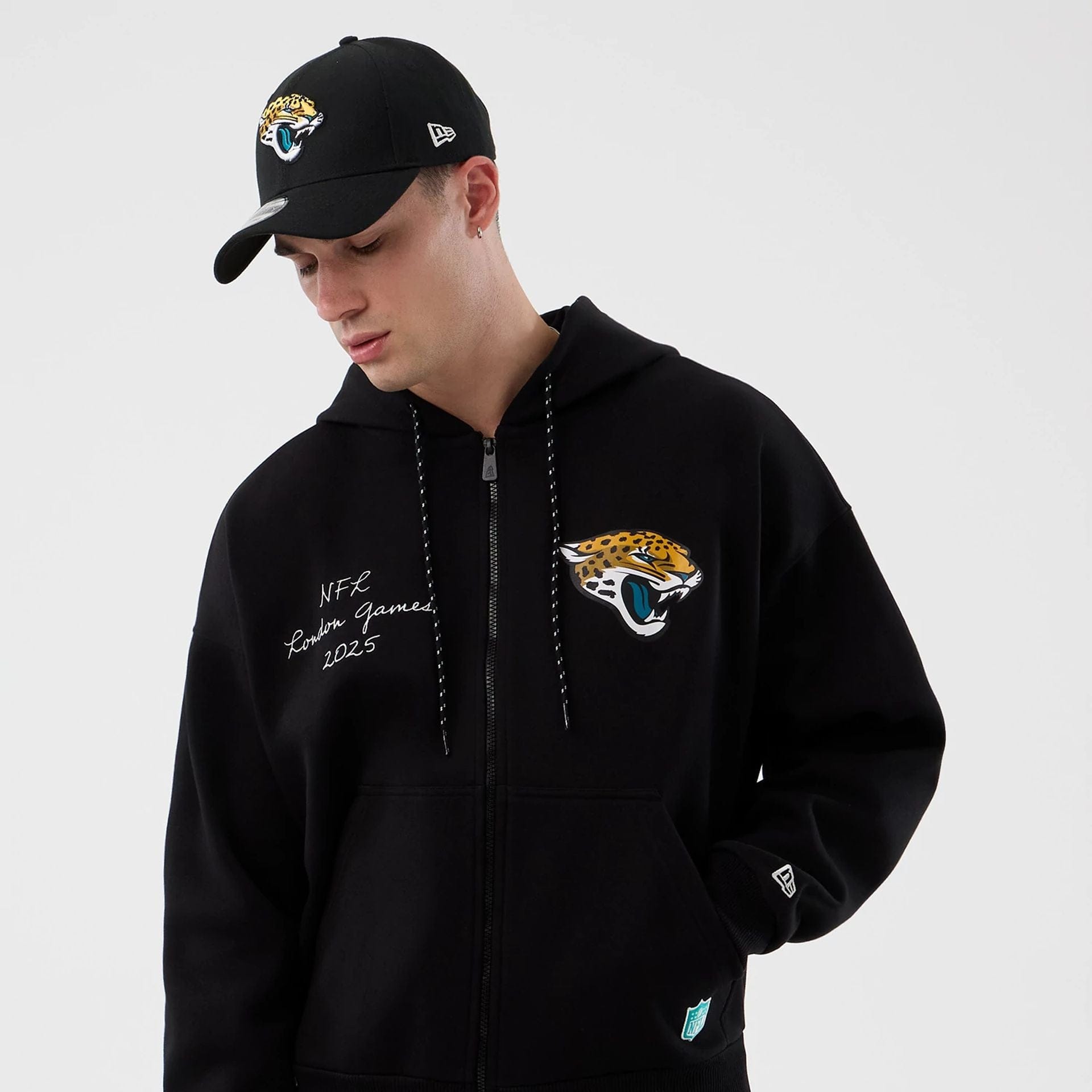 The Male model is wearing Jacksonville Jaguars NFL International Series Games Black Full Zip Hoodie  5
