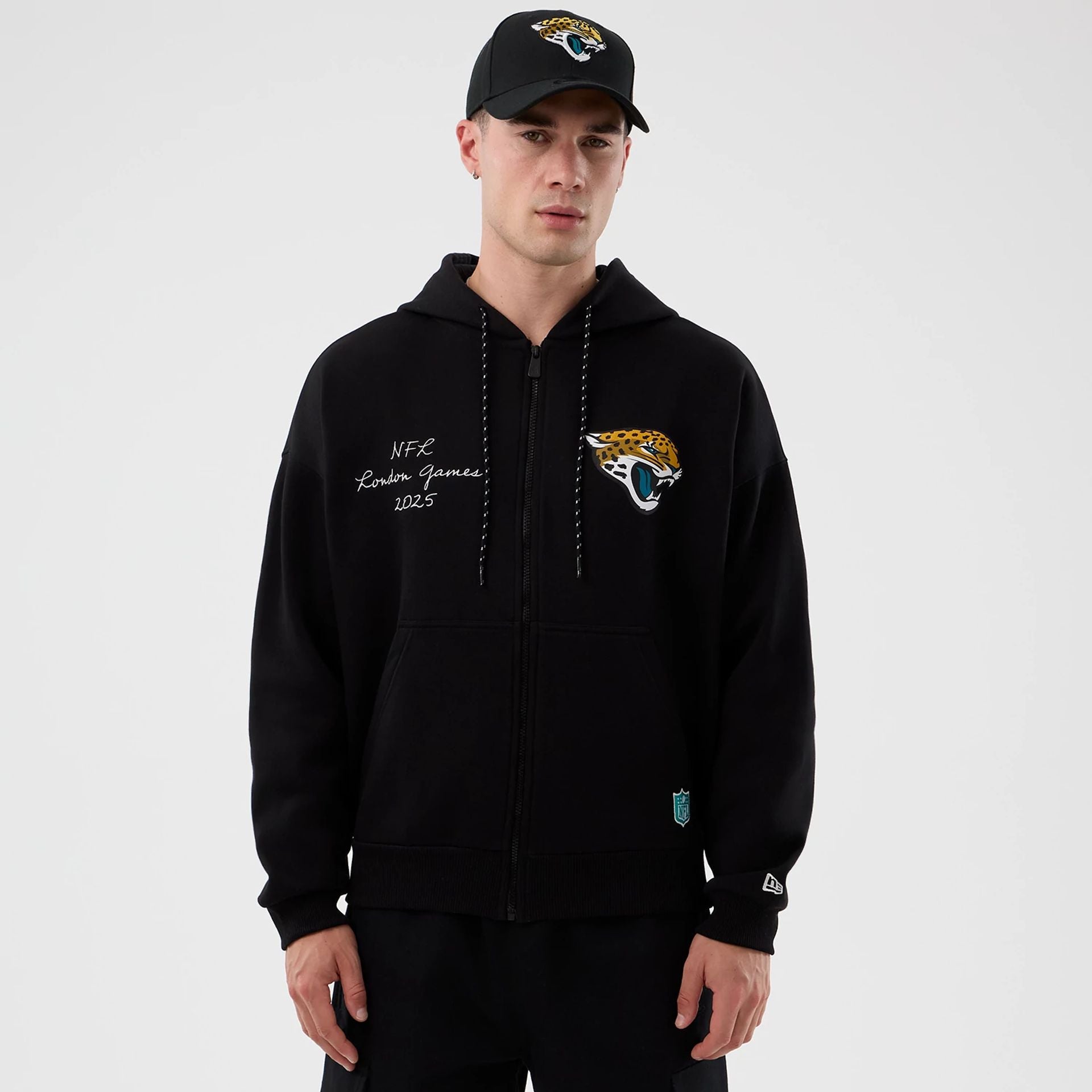The Male model is wearing Jacksonville Jaguars NFL International Series Games Black Full Zip Hoodie  1