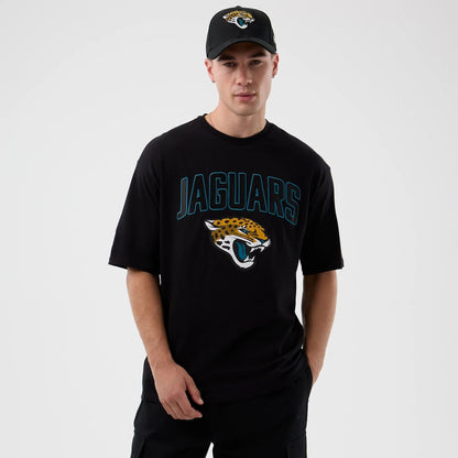 The Male model is wearing Jacksonville Jaguars NFL International Series Games Black Oversized T-Shirt  1