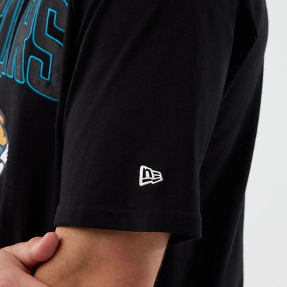 The Male model is wearing Jacksonville Jaguars NFL International Series Games Black Oversized T-Shirt  5