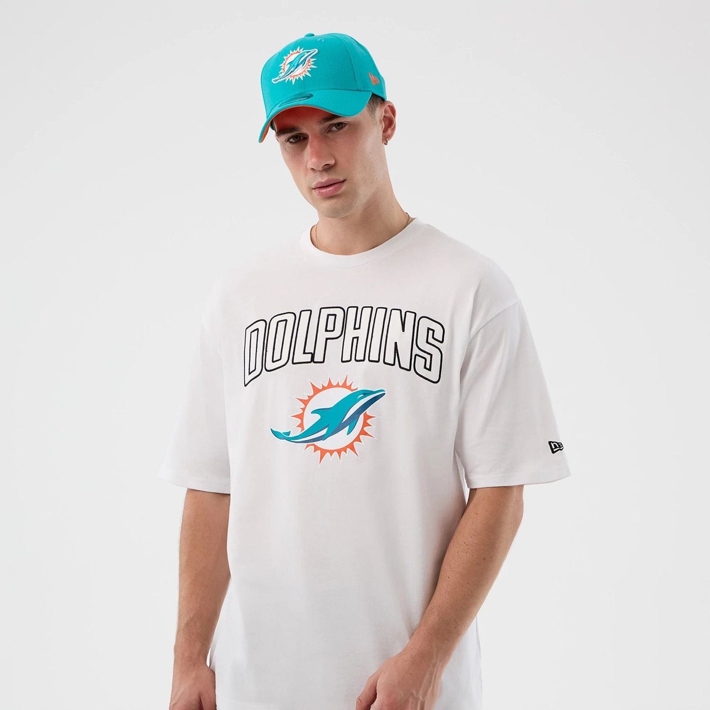 The Male model is wearing Miami Dolphins NFL International Series Games White Oversized T-Shirt  7