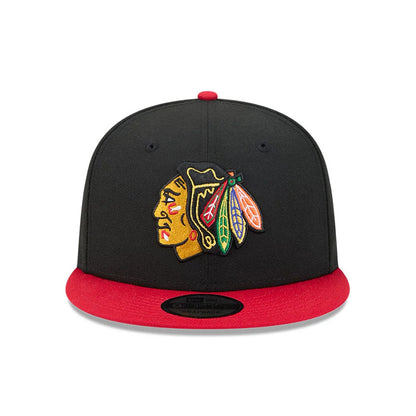 Pictured is this NHL Evergreen Chicago Blackhawks 9FIFTY Snapback cap in black. 3