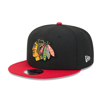 Pictured is this NHL Evergreen Chicago Blackhawks 9FIFTY Snapback cap in black. 1