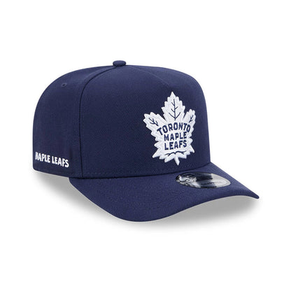 Pictured is this NHL Evergreen Toronto Maple Leafs 9FIFTY A-Frame Snapback cap in navy. 1