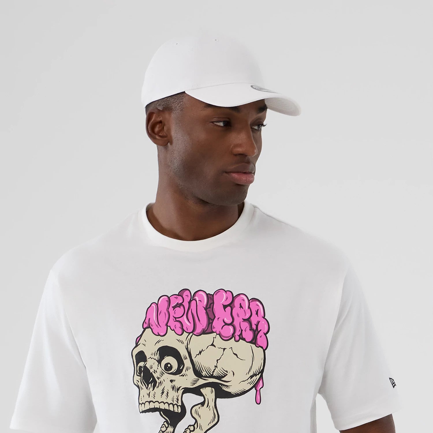 The Male model is wearing  New Era Halloween Skull Graphic White Oversized T-Shirt 5