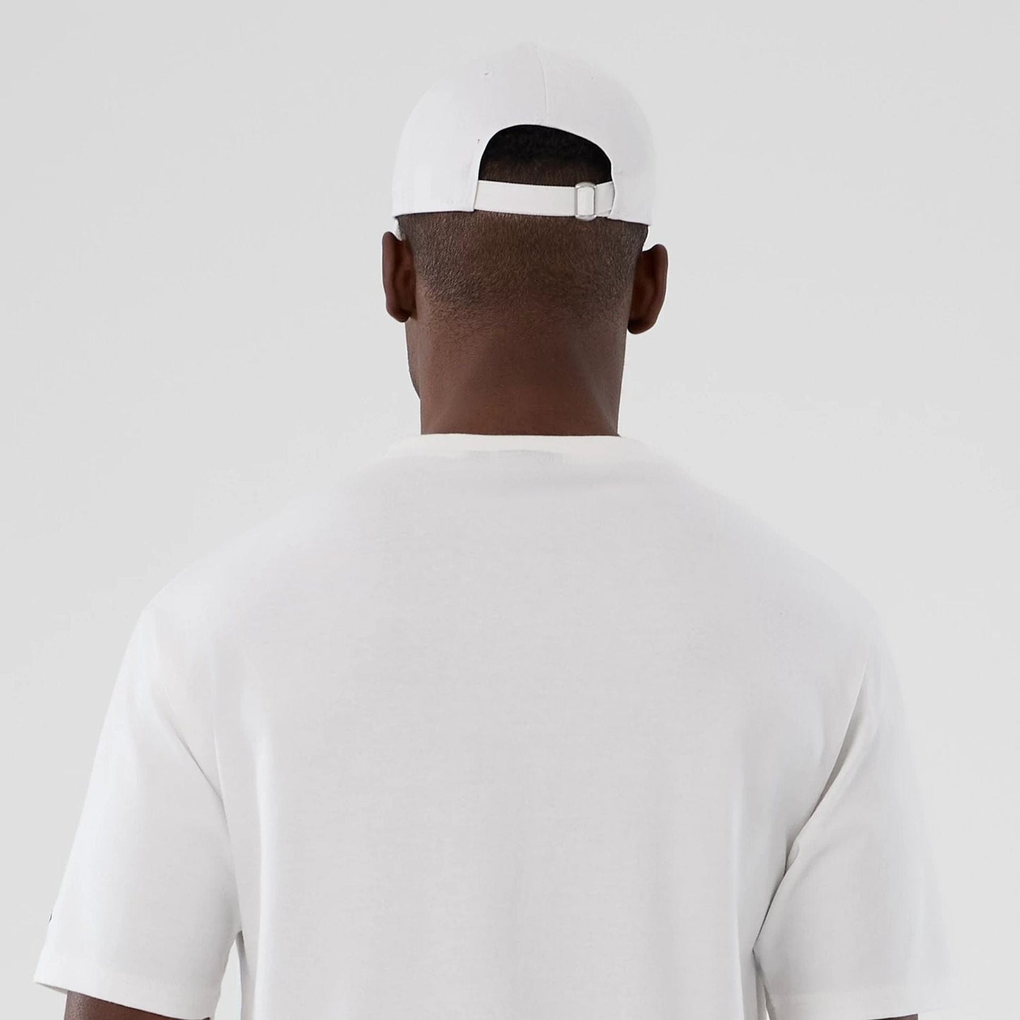 The Male model is wearing  New Era Halloween Skull Graphic White Oversized T-Shirt  7