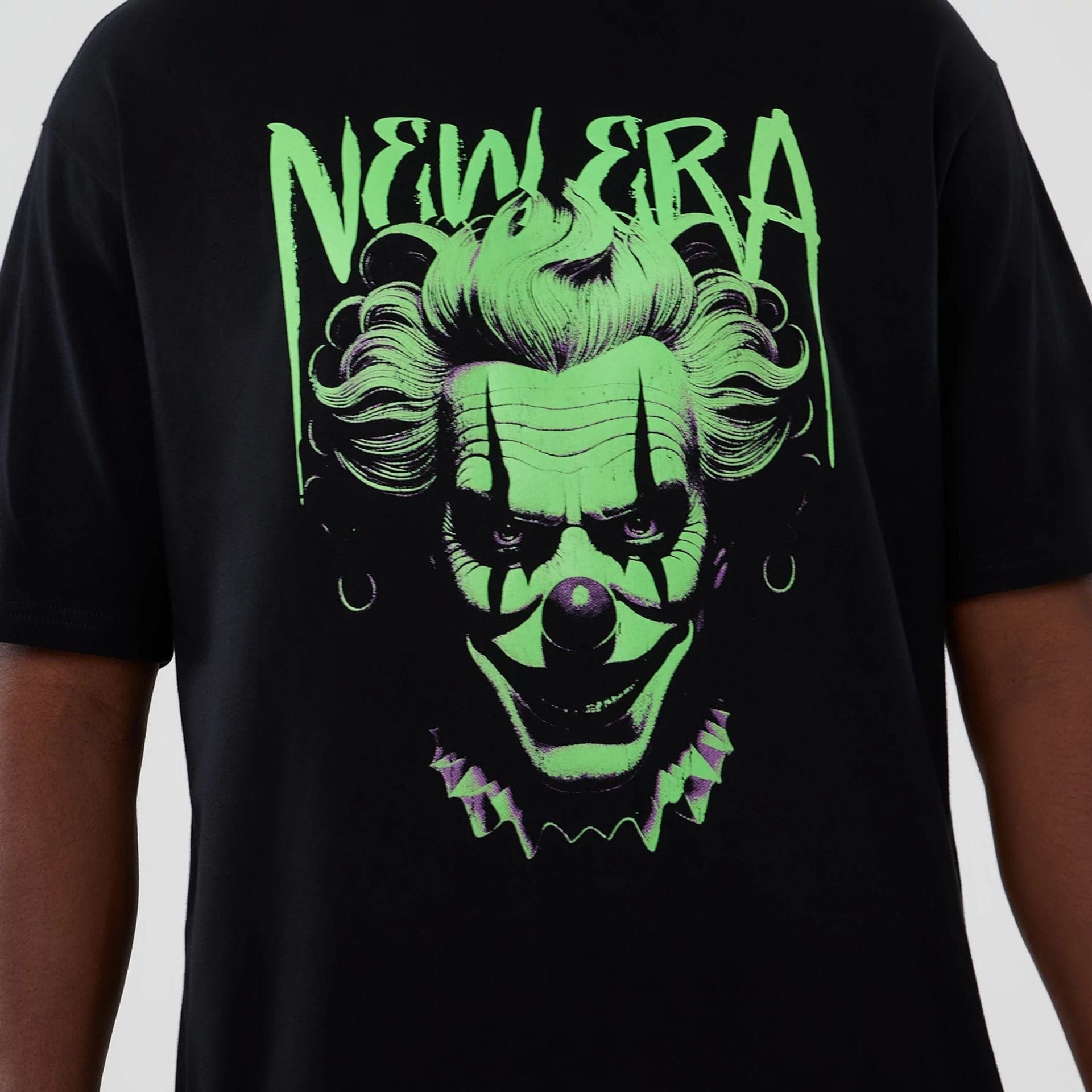 The Male model is wearing  New Era Halloween Clown Graphic Black Oversized T-Shirt  3
