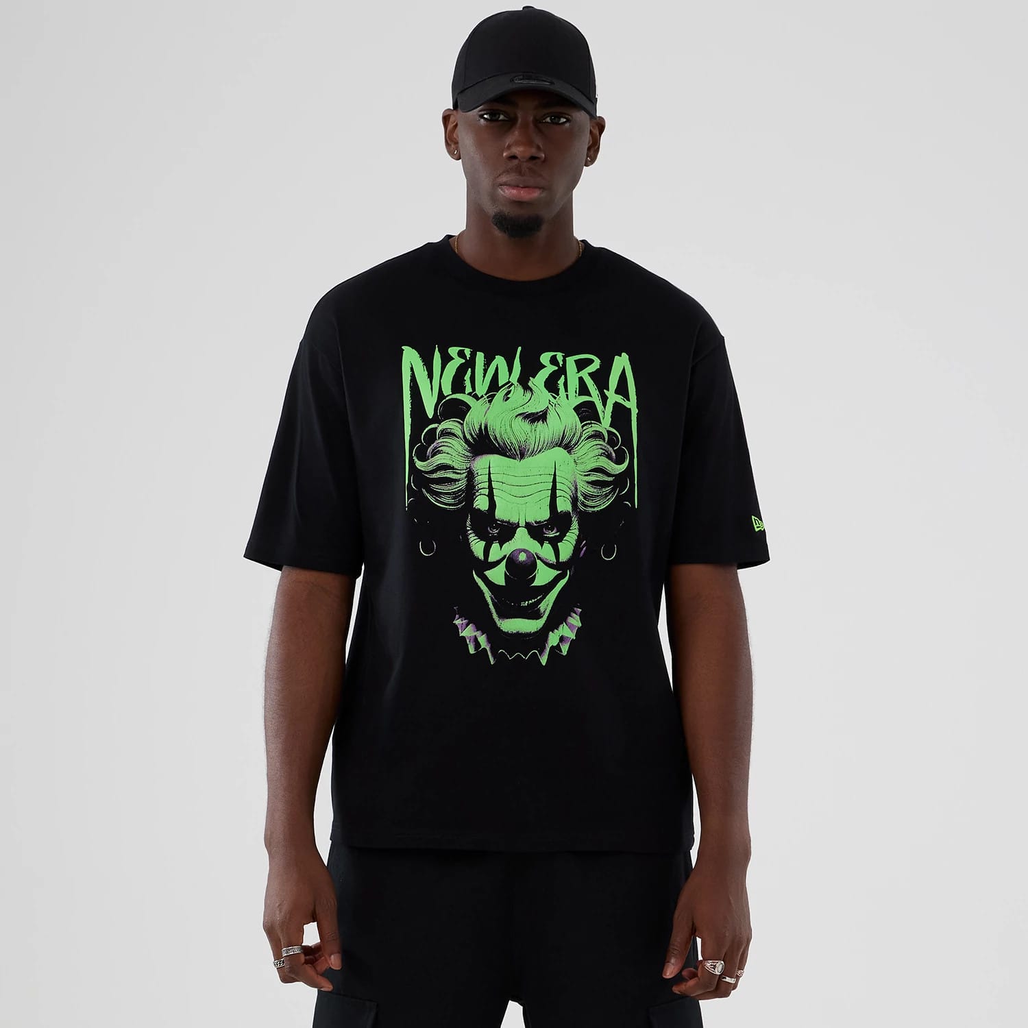 The Male model is wearing  New Era Halloween Clown Graphic Black Oversized T-Shirt 1