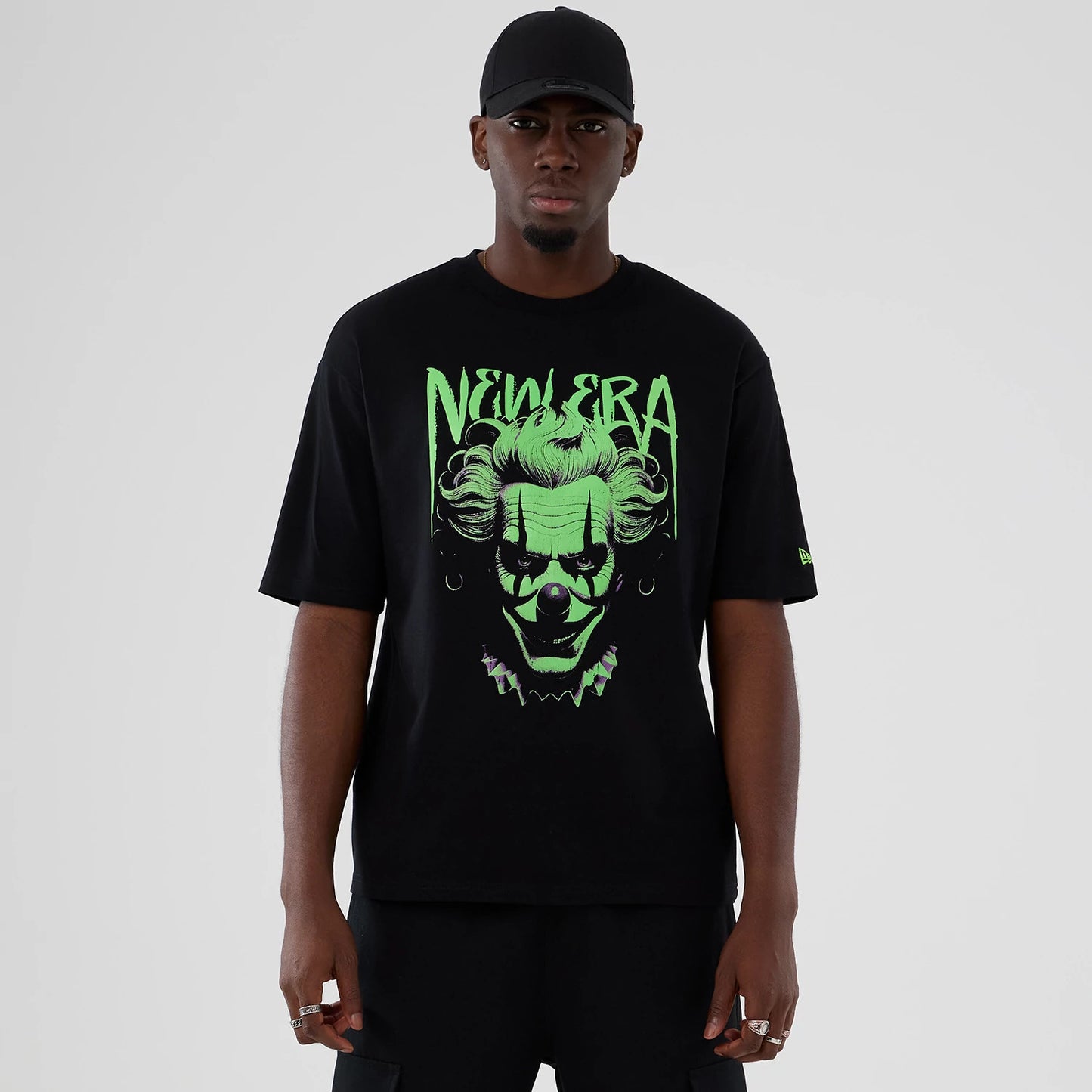 The Male model is wearing  New Era Halloween Clown Graphic Black Oversized T-Shirt 1